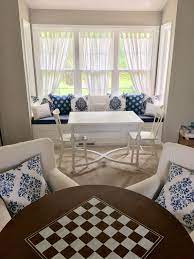 Built In Window Seat With Puzzle Table And Armchair Seating Area With Game Table Livingroom Layout Built In Window Seat Puzzle Table