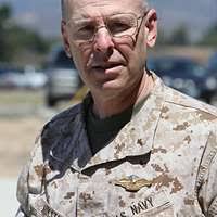 Vice Adm. John Morgan, Deputy Chief of Naval Operations for Information,  Plans and Strategy, listens to the conversation between panel members and  students of the University of Denver's Graduate School of International