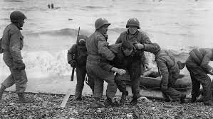 Along the coast of normandy the flags were out. Watch Vintage Newsreel Footage Of The D Day Landings In Normandy Mental Floss