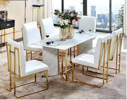 The dining table by the diamond sofa is a true centerpiece for any home's décor. China Stainless Steel Marble Dining Table Luxury Italian Dining Table Set 6 Chairs Modern Dining Room Furniture Marble Top Dining Table Set China Home Furniture Dining Table