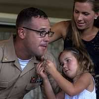 U.S. Marine Corps Maj. Mario Parzino greets members