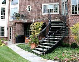 This contemporary home boasts distinctive curved rooflines with a striking design, an open floor plan with dramatic mountain views from every window. Curved Staircase Wrought Iron Belly Rail Great Lakes Metal Fabrication