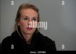 In this Aug. 1, 2012 photo, Craig Racster, left, and Rhonda Belford, of the  Illinois state treasurer's office, help individuals claim property during  an I-Cash event attended along with Treasurer Dan Rutherford