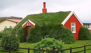 Photo about a large yellow luxury house with a green roof. Green Roof House