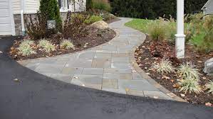 Use the brick saw to cut the pavers that will fit the curves of the walkway. Front Entry Landscaping Front Walkway Walkway