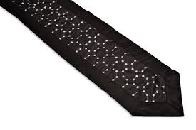 This sandra table runner features lovely quality crushed velvet with a sparkly diamante strip of bling down the centre. Hexagonal Black Table Runner With Silver Metallic Look Sequins Easycare Tablecloths