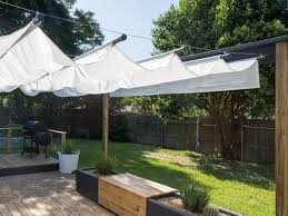 Locate a camping website that features a sequence of adjacent trees. How To Build An Outdoor Canopy Hgtv