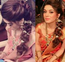 The braided bun can easily be made within few simple steps to complete the ordinary saree look. Hairstyles For Sarees Wrytin