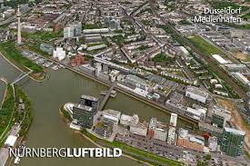 The property is also next door to fromagerie armel laas, and near a tram stop. Dusseldorf Medienhafen Luftbild