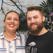 Who can photograph two families in Orange Beach or Gulf Shores between  7/27-7/30?