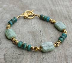 Girl Beach Bracelets This Handmade Gemstone Bracelet Features Blue And Green Kyanite Beads Accented With Beach Bracelets Beaded Bracelets Beaded Jewelry Diy