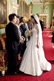 Kate middleton changed into a second wedding dress before the royal wedding reception at buckingham palace!. Celebrity Entertainment A First Look At Prince William And Kate Middleton S Royal Wedding Cake Kate Middleton Wedding Middleton Wedding Wedding Dresses