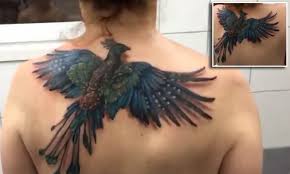 Drawing sketches wing tattoos wing tattoo arm. Woman S Phoenix Tattoo Rises Appears To Take Flight Daily Mail Online