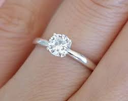 Engagement Ring A Simple Diamond On Sterling Silver The Band Slightly Flat Not Round W Simple Engagement Rings Wedding Rings Simple Wedding Rings Solitaire