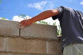 To learn how to apply stucco to a surface, scroll down! How To Cover Exterior Cinder Block Walls