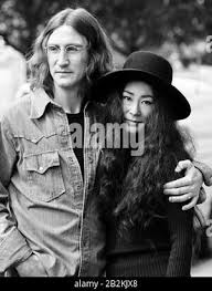 Avant Garde Artist Yoko Ono Widow Of John Lennon Removes Her Shoes And Shares A Word With Their Son Sean Lennon L Who Holds Scissors To Cut A Piece Of Her Dress At