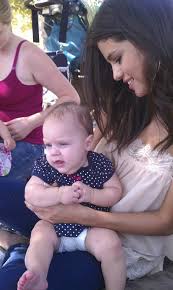 Selena Gomez Holding A Baby
