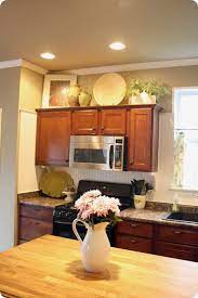 Unusual decorate above kitchen sink window. How To Decorate Above Kitchen Cabinets From Thrifty Decor Chick