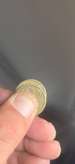 Hello everyone think I've found something Got a 2009 $1 coin 1 little  section it is silver and not gold and the front is very rough any thoughts 