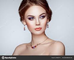Portrait Beautiful Woman Jewelry Fashion Makeup Cosmetics Elegant Hairstyle Violet  — Stock Photo © heckmannoleg #206580718