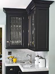 Bold Black Cabinets Fitted With Wire Mesh Door Fronts Enhance The Customization Of Kitchen Cabinets Glass Inserts Kitchen Cabinets Upgrade New Kitchen Cabinets
