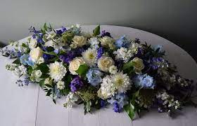 A Casket Spray Of Blues And Whites Casket Sprays Funeral Flower Arrangements Funeral Floral
