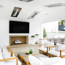 There are louvered cabinet doors on both sides of the firebox and an adjustable shelf for ample media storage. Outdoor Fireplace Tv Niche Design Ideas