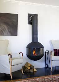 Instead, it hides them in a weighted modern holder that looks like something else. Stand Alone Fireplace Family Room Contemporary With Raised Hearth Cushion Back Swivel Glider Recliner Chairs
