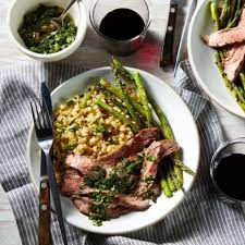 This Elegant Steak Dinner For Two Features Asparagus Drizzled With A Bright Chimichurri Sauce A Bed Of Ca Steak Dinner Flank Steak Chimichurri Healthy Recipes