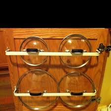 Diy Cooking Pan Lids Stored On Curtain Rods Cuttheclutter Cheap Curtain Rods Pot Lids Household Hacks