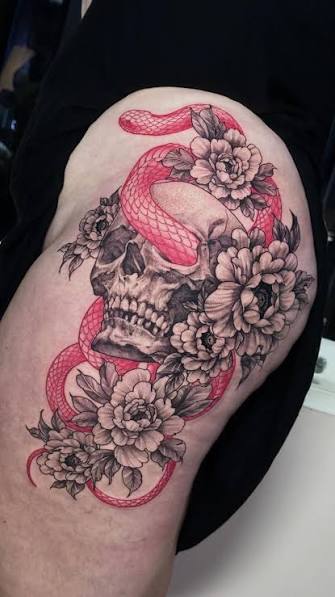 Black and grey skull and floral thigh tattoo with red snake detail 🖤🐍, This bold custom thigh tattoo features a realistic black and grey skull surrounded by soft peony flowers and wrapped with a ...