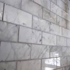 The most thorough and complete solution is to remove the grout and install new, grout in the color of your choice. White Carrera Marble With Gray Grout White Marble Mosaic Home Decor Tips White Kitchen Inspiration