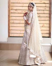 Well undoubtedly, the charm of quintessential red bridal lehengas is inescapable. Crushing On This All White Lehenga Shaadibazaar Wedding Indianwedding Indian Bridal Outfits Indian Bridal Lehenga Indian Bridal Dress