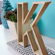 At first, your toddler may be more focused on putting the sticks in the eventually, you'll be able to hand your child a green popsicle stick and provide direction such as, can you place this stick that is green in the. Diy Letters Made From Coffee Stirrers Easy Room Decor Karen Kavett Diy Popsicle Stick Crafts Craft Stick Crafts Easy Room Decor