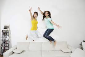 Women in large cities such as odessa or kiev enjoy visiting the park on a warm summer day. Young Women Having Fun And Jumping On Couch 18 19 Years Two People Stock Photo 183338500