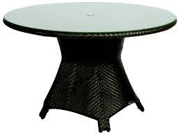 At the end of the year, be sure to protect your new outdoor dining chairs with weatherproof outdoor furniture covers. Woodard Trinidad Wicker Java 48 Wide Round Glass Top Dining Table With Umbrella Hole Wr6u0165j