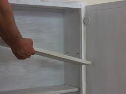 How do you mount a tv on the wall? Turn A Kitchen Cabinet Into A Flat Screen Tv Cover Hgtv