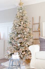 A Snowy Flocked Christmas Tree Nick Alicia Snowy Christmas Tree Cool Christmas Trees Rose Gold Christmas Decorations