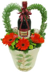 Wine For The Hostess Great Way To Present Creative Flower Arrangements Tropical Floral Arrangements Flower Shop Design