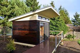 I see your house as a very successful hybrid of both the contemporary (think ranch house with wide overhanging eaves and a sometimes flat roof) and shed styles. Shed Roof Design Architectural House Plans 153236