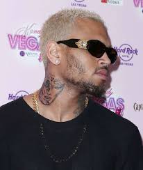 Chris brown talks to us about what his tattoo regrets are, what his most recent neck tattoos mean and how he dealt with the pain of. Is Chris Brown S Neck Tattoo Of Rihanna S Face Singer Shows Off Ink Of Brutally Beaten Woman But Denies It S His Ex New York Daily News