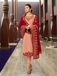 You have the red dirt of the baseball diamond, the green grass in the outfield, the bright sun in a blue sky overhead. Peach Red In Combination Traditional Churidar Suit