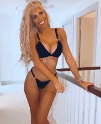 She wore her brunette locks in soft curls and shielded her eyes from the sun with aviators. Chloe Ferry Debuts New Brunette Locks As She Strips Down To Thong Bikini