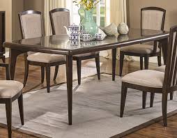 Sleek comfort meets elegant style in this exquisitely crafted padded wooden dining chair and table set. Metropolitan Dining Set 5pc In Walnut By New Classic W Options