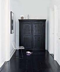 Dramatic Effect With Black Floor Painted And White Walls The Juxtaposition Of A Modern Chair Wit Black Floorboards Black And White Interior White Interior