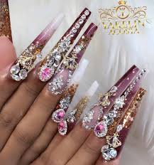 These nails do just that with their black matte center nail leading out to a tarnished black and purple nail and finally ending with an explosion of pretty purple glitter. Nail Art Bling 75 Amazing Designs You Can Try Now