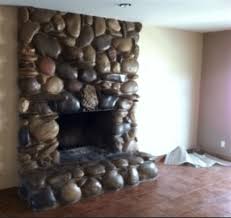 We painted a 50 yr old fireplace white and made it sparkle with glitter. Here It Is The Ugliest Stone Fireplace You Ve Ever Seen Laurel Home