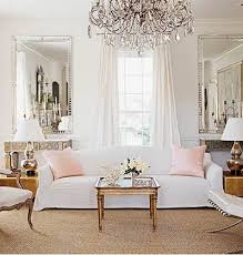 Bright White Parisian Style Living Room Stunning Statement Chandelier Gold Accents And Beautiful Details Are What Make T French Living Rooms Home White Decor