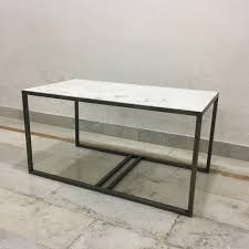 A simple contemporary coffee table featuring a rectangular top of wood with encrusted. Iron Coffee Table With Stone Top Nadeau Savannah