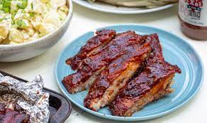 How To Grill Ribs In 4 Easy Steps Recipe In 2021 Ribs On Grill Easy Rib Recipes Smoked Food Recipes